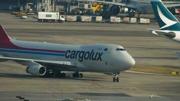 HONG KONG NOVEMBER 7, 2019 - Freight carrier Boeing 747, LX ICL of Cargolux taxiing at Chek Lap Kok International Airport, Hong Kong. Cargo plane on the airfield video