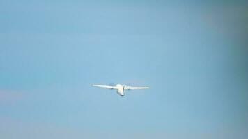 Turboprop airplane taking off and climbing. Rear view, passenger plane flies away. Tourism and travel concept video