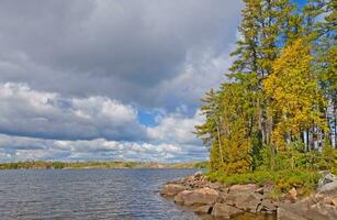 Fall colors and clouds in the north woods photo