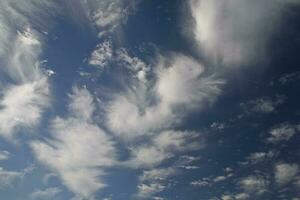 blue sky with white original clouds forming an interesting pattern photo