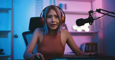 Asian young Esport woman gamer play online game on PC photo