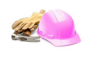 Pink Safety Construction Hard Hat, Hammer and Leather Gloves Isolated on a White Background. photo