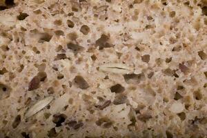 original background from wholemeal wholemeal bread with grains in a close-up photo