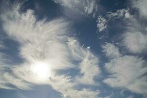 blue sky with white original clouds forming an interesting pattern photo