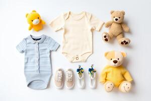 Cute baby clothes for boy and girl, rattle, bottle and dummy space in the middle, on white background top view. photo
