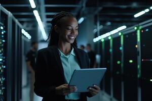 Successful Female Data Center IT Specialist Using Tablet Computer. photo