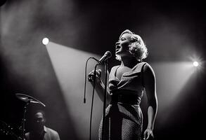 Female jazz singer on stage during a concert illuminated by show lights. . photo