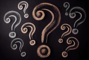 Question marks chalk drawing on blackboard background . . photo