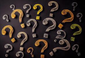 Question marks chalk drawing on blackboard background . . photo