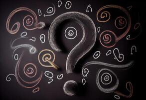 Question marks chalk drawing on blackboard background . . photo