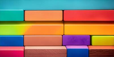Spectrum of stacked multi-colored wooden blocks. photo