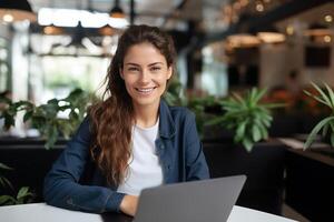 Portrait of a Happy Smiling Female, Using Laptop Computer, Looking at Camera and Smiling. Empowered Information Technology Specialist, Software Engineer or Developer. photo