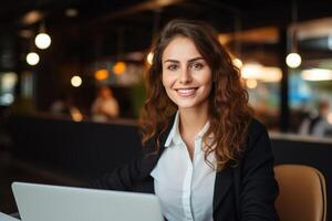 Portrait of a Happy Smiling Female, Using Laptop Computer, Looking at Camera and Smiling. Empowered Information Technology Specialist, Software Engineer or Developer. photo