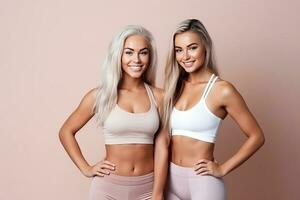 Two fit young women stand together in sportswear, embracing a healthy lifestyle in the studio clean background. AI Generated photo
