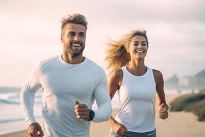 Cheerful European lady and man enjoying active lifestyle and training on ocean beach, having break and posing . photo