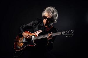 Portrait of a cool trendy old woman playing a guitar on black studio background. AI Generated photo