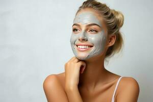portrait of a smiling happy young beautiful woman smiling while pampering his skin with a face mask on white background. AI Generated photo
