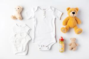 Cute baby clothes for boy and girl, rattle, bottle and dummy space in the middle, on white background top view. AI Generated photo