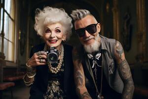 smiling old tattooed fashion woman and man with bold hair. photo
