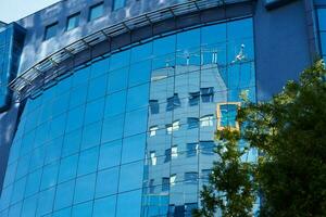 Modern office building with green trees photo