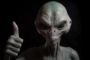 Alien humanoid shows thumb up gesture on dark background. photo