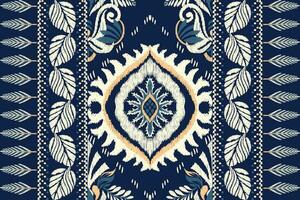Ikat floral paisley embroidery on navy blue background.Ikat ethnic oriental pattern traditional.Aztec style abstract vector illustration.design for texture,fabric,clothing,wrapping,decoration,scarf.