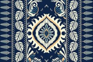 Ikat floral paisley embroidery on navy blue background.Ikat ethnic oriental pattern traditional.Aztec style abstract vector illustration.design for texture,fabric,clothing,wrapping,decoration,scarf.