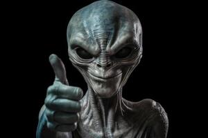 Alien humanoid shows thumb up gesture on dark background. photo