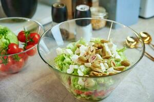 Green fresh vegetable salad in bowl photo