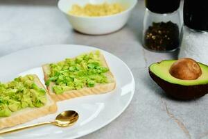 Toasts with avocado on plate, Healthy nutrition photo