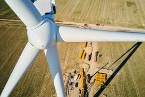 Construction site near windmill turbine, Wind generator installing photo