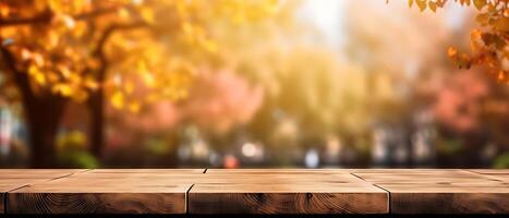 Empty Wooden table in garden of fall time. photo