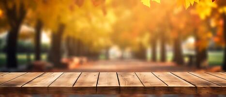 Empty Wooden table in garden of fall time. photo