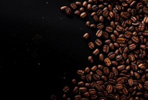 Fresh Coffee Beans On Dark Background with empty space for text. photo
