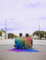 Boys couple with rainbow colored shirt. Concept of LGBT pride. photo