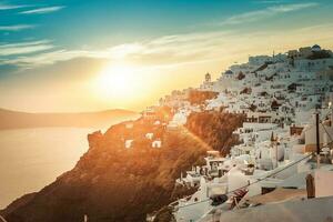 Sunset view from Imerovigli town of  Santorini island in Greece photo
