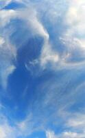 Divine blue sky and fluffy white clouds photo