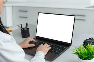 Laptop computer mockup. Woman work on laptop in office. Business composition. Isolated screen for web page presentation photo