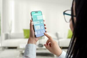 User interface and experience concept app on smart phone in woman hands. Clean design with flying app modules concept photo