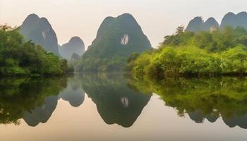 Tranquil karst formation reflects mountain peak in idyllic rural scene generated by AI photo