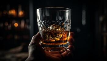 A hand holding a whiskey glass, enjoying the night elegance generated by AI photo