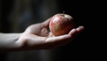 A ripe apple, held by a human hand, promotes healthy eating generated by AI photo