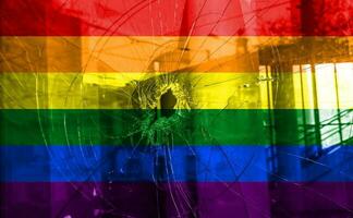 Flag LGBT community pride on a broken glass background. Raimbow gay culture symbol. Concept collage. photo