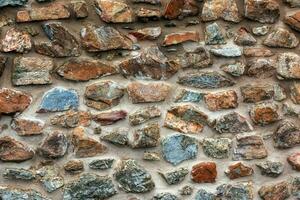 The texture of the stone wall. Background texture of the stone wall of the old castle. Stone wall as background or texture. photo