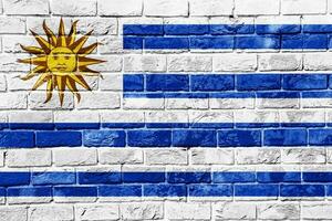 Flag of Eastern Republic of Uruguay on a textured background. Concept collage. photo