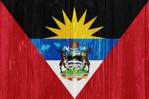 Flag of Antigua and Barbuda on a textured background. Concept collage. photo