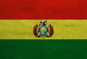 Flag of Bolivia on a textured background. Concept collage. photo