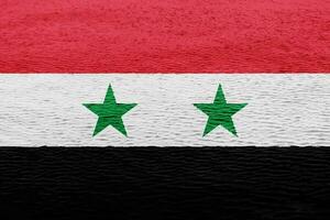 Flag of Syrian Arab Republic on a textured background. Concept collage. photo