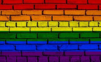 Flag of the LGBT community on the background of a stone wall. Rainbow symbol of gay culture. Concept collage. Illustration symbol of pride. photo