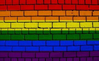 Flag of the LGBT community on the background of a stone wall. Rainbow symbol of gay culture. Concept collage. Illustration symbol of pride. photo